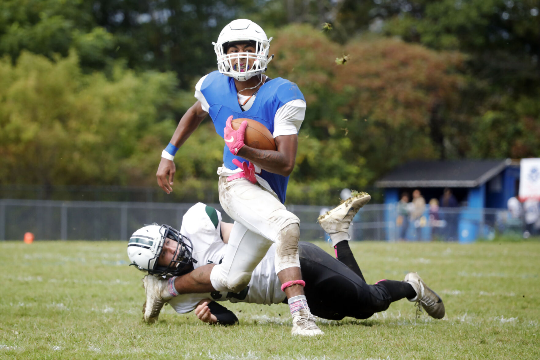 Troy Wnuk tries to tackle Louis Guilotte in football game